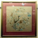 A Chinese inspired embroidered silk panel, decorated with flora  18" x 18"  framed