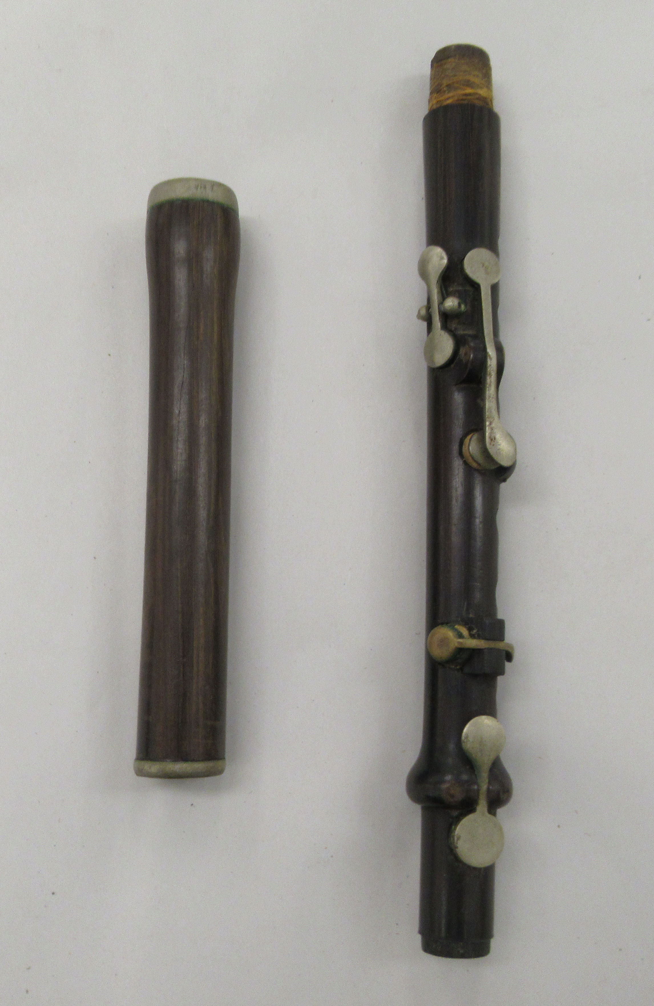 A Potter & Co two piece rosewood flute; and another Potter & Co three piece flute - Image 4 of 5