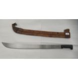 A South American machete  bears a label  the blade 26"L in a tan coloured hide sheath