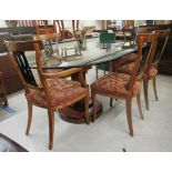 A modern Art Deco inspired burr walnut veneered and ebonised figure-of-eight design, twin pedestal