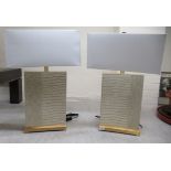 A pair of brass framed and cream coloured faux crocodile skin effect hide covered table lamps  27"