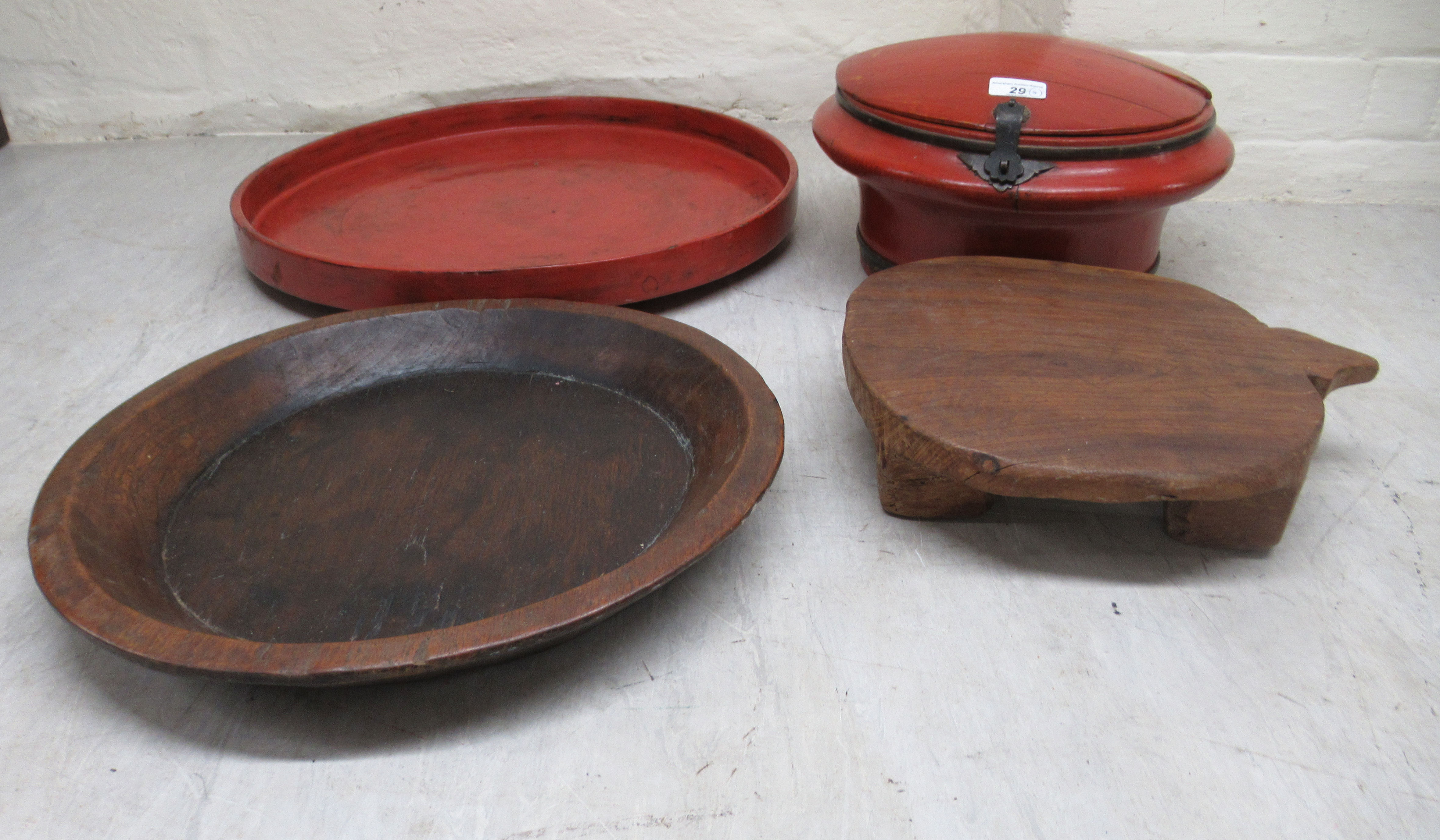 A mixed lot: to include a rustically carved trivet; a shallow bowl  14"dia; a red lacquered tray