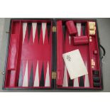 A Geoffrey Parker black, red and tan coloured hide backgammon set