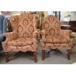 A ladies and gentlemans 1930s mahogany framed library style wingback enclosed armchairs, upholstered