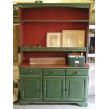 A modern green and red painted kitchen dresser, the superstructure with open shelves, over three