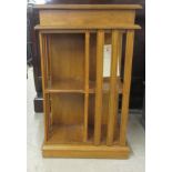 A J M Harries of Pembrokeshire oak two tier revolving bookcase, on a plinth  35"h  22"sq