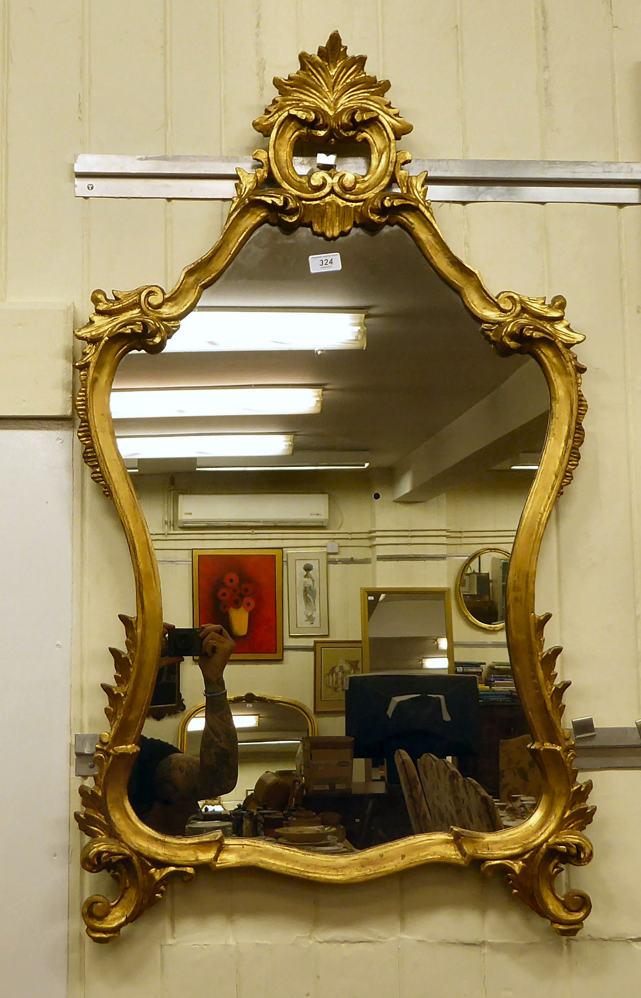 A Victorian style pier glass, the shaped plate set in a foliate scrolled gilt framed  47"h  24"w