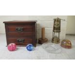 A mixed lot: to include two Caithness glass paperweights  2"h; and an E Thomas & Williams Ltd miners