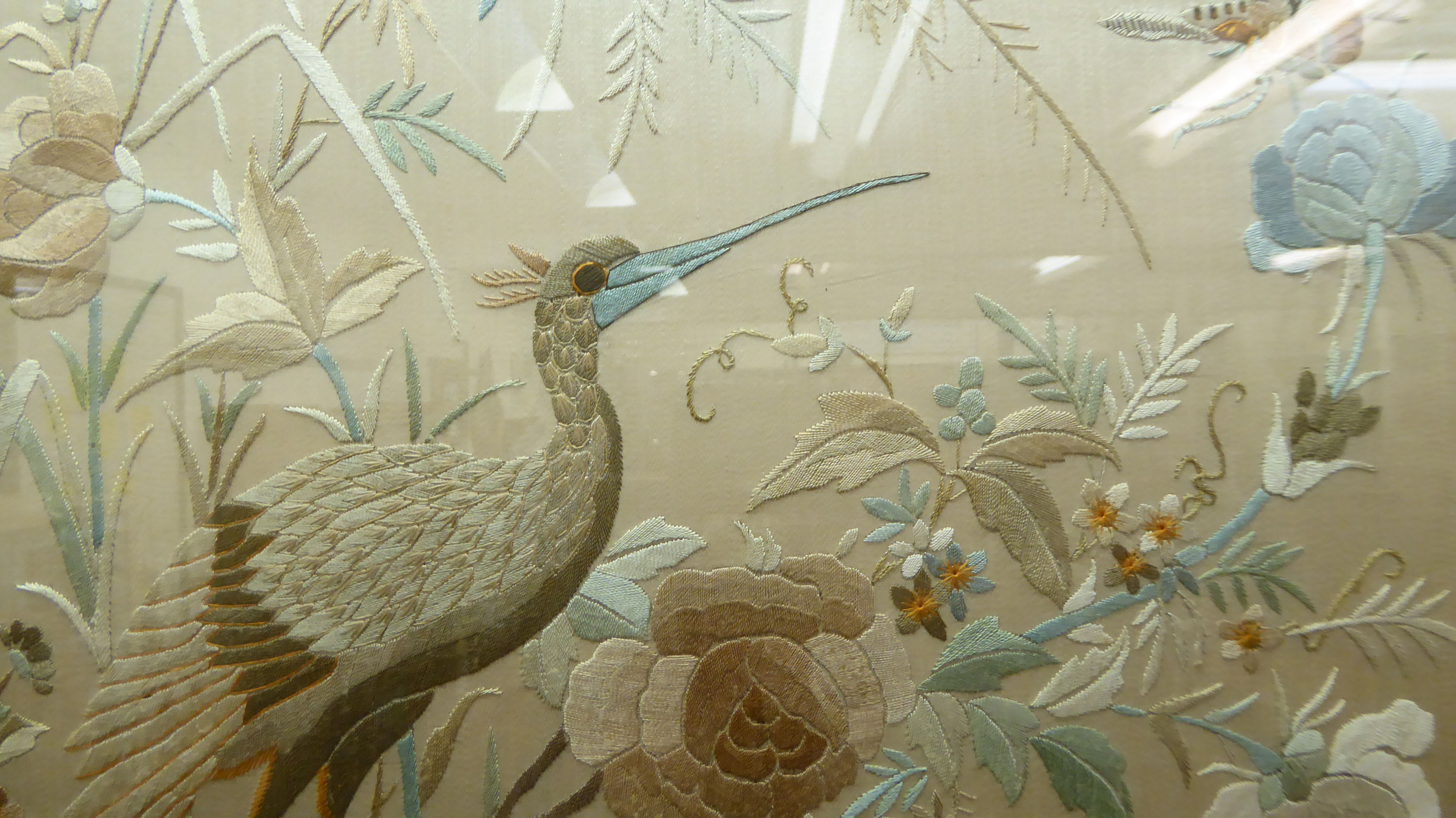 A Chinese inspired embroidered silk panel, decorated with flora  18" x 18"  framed - Image 2 of 2