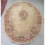 A Chinese washed cotton rug, decorated in traditional taste in pastel tones  86"dia