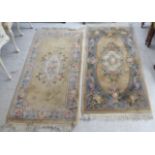 Two similar Chinese washed cotton rugs, decorated with flora in pastel tones  30" x 50"