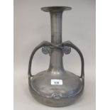 An early 20thC Arts & Crafts Tudric pewter vase of squat bulbous form with opposing scrolled handles