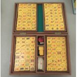 A modern Mah-Jong set with composition tiles  cased