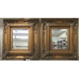 A pair of modern antique inspired mirrors, the bevelled plates set in a moulded gilt frame  18" x