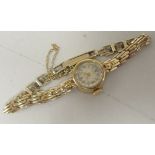 A ladies 9ct gold bracelet watch, faced by an Arabic dial