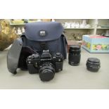 A Pentax LX camera and case; two Pentax adjustable lenses; and a photographers shoulder bag