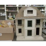 A scratch built dolls house  28"h  24"w; and a collection of furniture and lighting