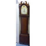 An early 19thC oak longcase clock, having a swan neck pediment, on and arched hood, over a