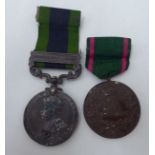 A George V period service medal  stamped India on the obverse, Waziristan 1921-24 on coloured