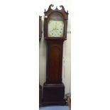 An early 19thC mahogany and oak longcase clock, having a swan neck pediment and arched window,