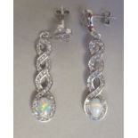 A pair of silver and cubic zirconia set drop earrings
