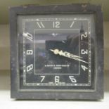 An S Smith & Sons black painted metal framed 8 day motor car dashboard clock  5"sq