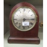 An early 20thC mahogany cased mantel clock; the movement faced by a Roman dial  10"h