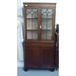 A late 19thC/early 20thC satinwood inlaid and crossbanded mahogany standing corner cupboard with a