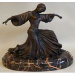 A modern Art Deco style patinated bronzed metal figure, a female dancer, on a marble plinth  12"h