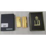 A gold plated Dunhill lighter, model no.C62814; and another gold plated example