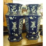 A pair of modern Chinese porcelain blue glazed vases of octagonal form, decorated in relief with