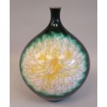 A 20thC dark green enamel spherical vase, having a short narrow neck, decorated in colours with
