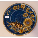 An early 20thC Gerbruder Schultz Austrian moulded pottery wall plate, decorated in turquoise and