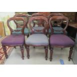 A set of six Victorian mahogany framed balloon back dining chairs, the fabric upholstered,