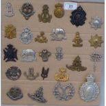 Twenty-six military regimental cap badges and other insignia, some copies: to include 19th Alexandra