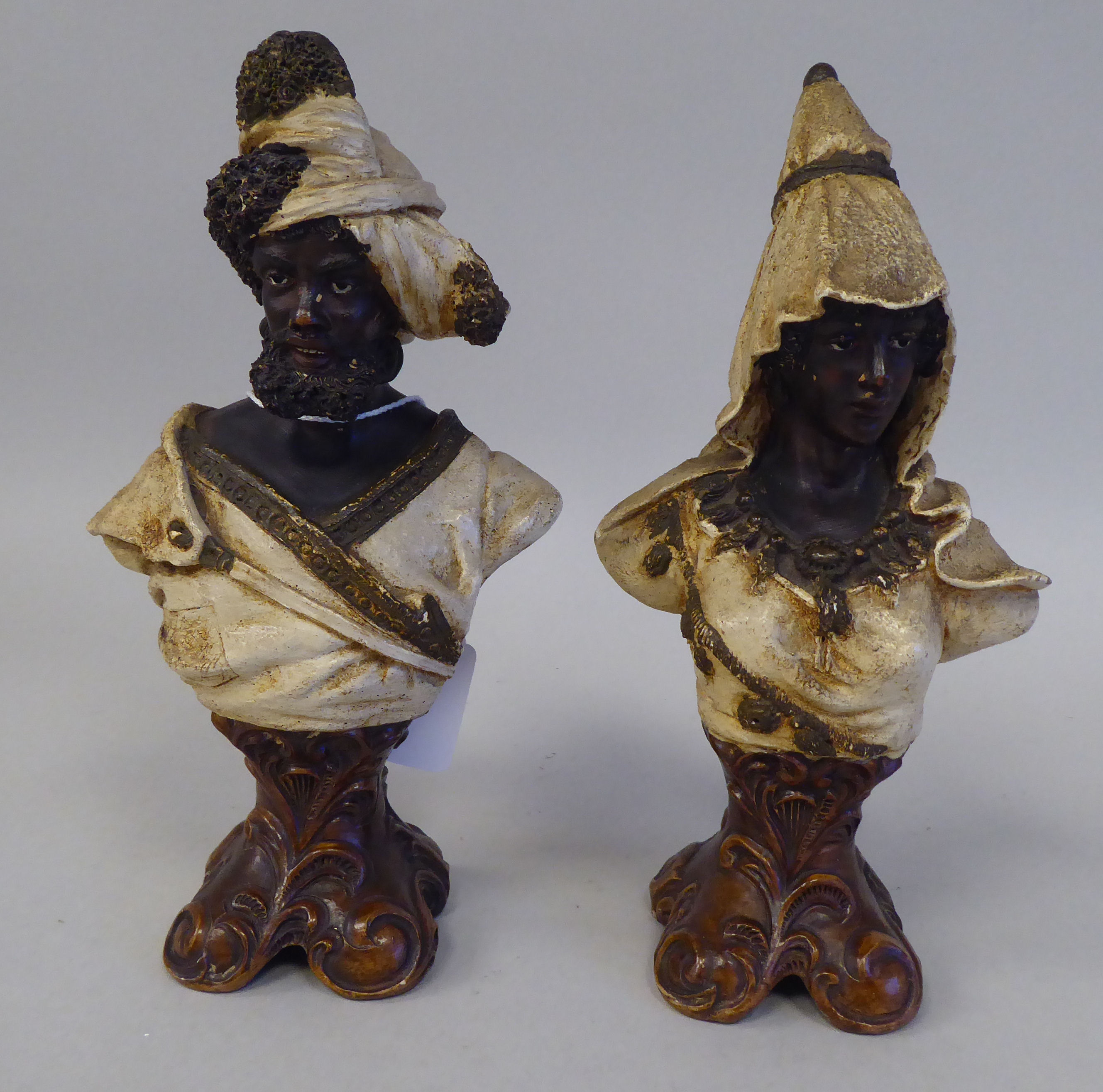 A pair of late 19thC Johann & Maresh painted terracotta Arab busts, a bearded man and a young