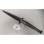 A Commando knife with a textured, elliptical handgrip and button pommel  the blade 6.5"L   (Please