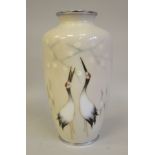 A 20thC mushroom coloured enamel vase of baluster form, decorated in colours with cranes  10"h