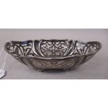 A silver oval basket with pierced, panelled and engraved butterfly ornament  CB Thomas & Co