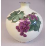 A 20thC pale cream coloured bulbous vase, decorated with purple grapes and vines  8.5"h