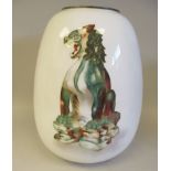 A 20thC white enamel bulbous vase, decorated in colours with a seated mythical lion-dog  12.5"h