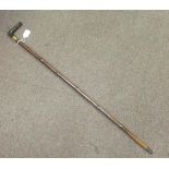 A late Victorian Brigg walking stick, the bamboo shaft with a brass tip, a right-angled