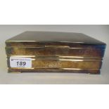 An Asian white metal cigarette box, the engine turned, hinged lid enclosing a cedar lined