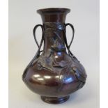 A 20thC patinated bronze bulbous vase, having a narrow neck and flared rim, naturalistically cast