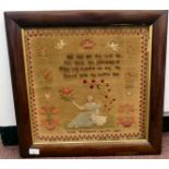 An early Victorian woolworked sampler, featuring a quatrain and pictorial ornament, the work by