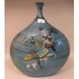 A 20thC Continental swirling blue glazed art pottery vase of flattened, bulbous form with a narrow