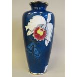 A 20thC sponged blue enamel vase of tapered baluster form, decorated in colours with an orchid  8.