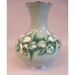 A 20thC pale green enamel vase of squat, bulbous form with a wide neck and flared rim, decorated