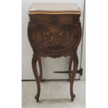 A late 19th/early 20thC French carved walnut pot cupboard of serpentine outline with a plate glass