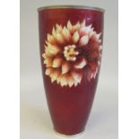 A 20thC oxblood coloured enamel tall beaker vase, decorated with stylised flowerhead design  10"h